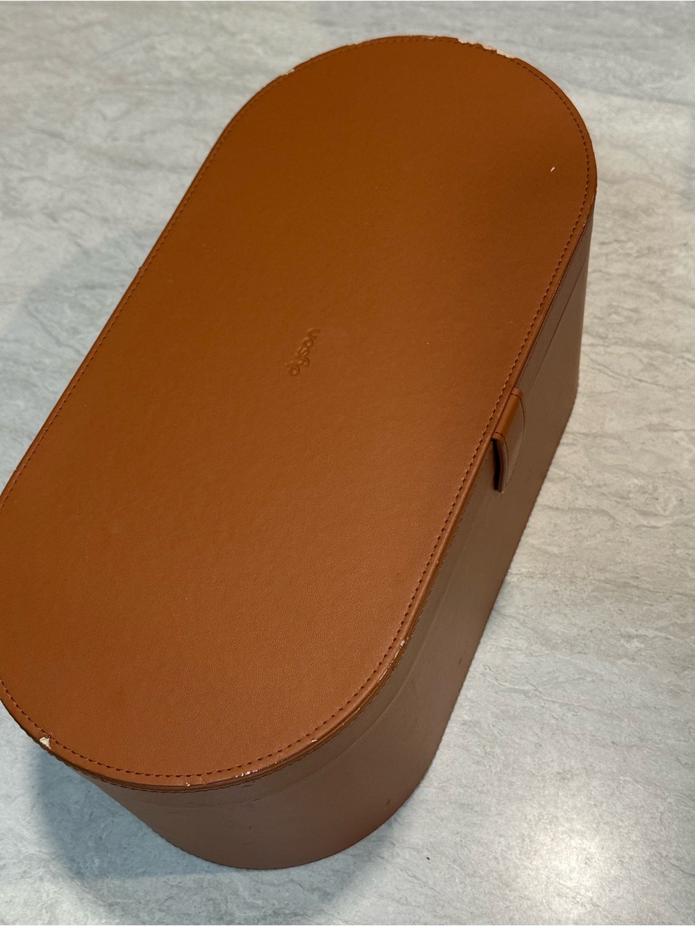 Dyson tan storage case and curling barrels